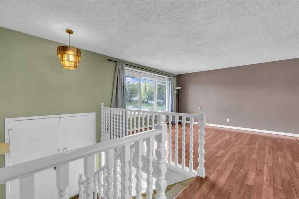 MLS® A2250254 - 403 Queen Alexandra Way SE in Queensland Calgary, Residential