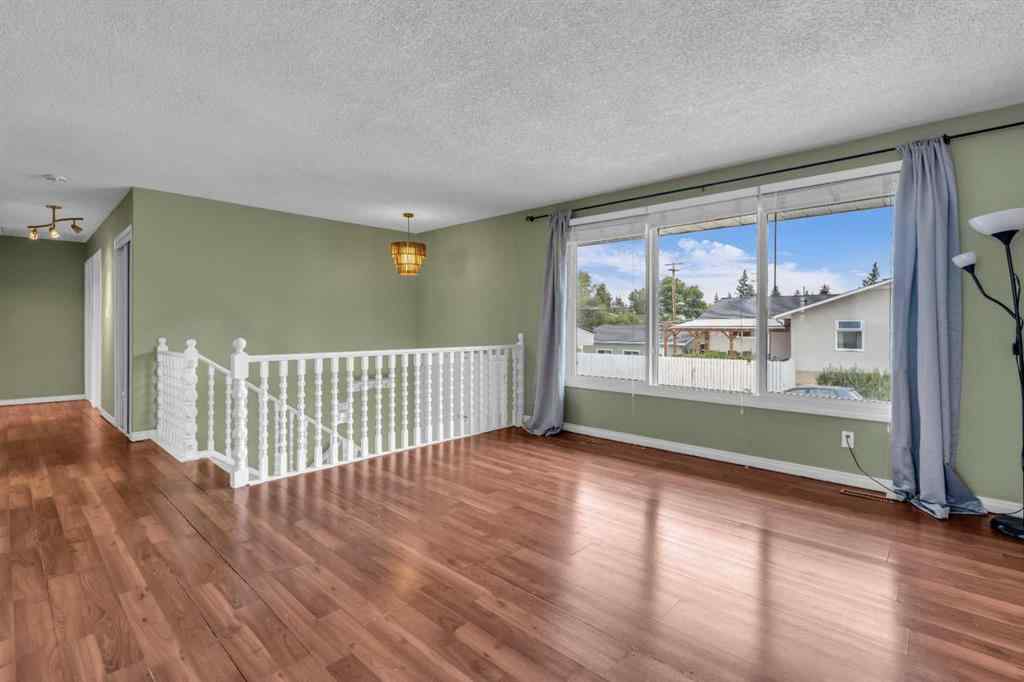 MLS® A2250254 - 403 Queen Alexandra Way SE in Queensland Calgary, Residential
