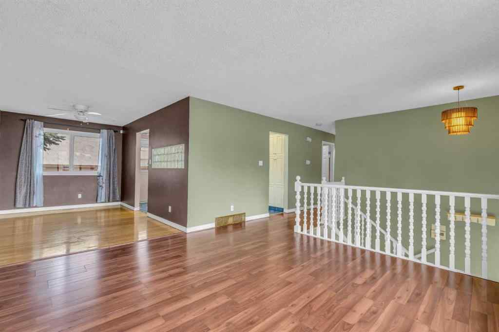MLS® A2250254 - 403 Queen Alexandra Way SE in Queensland Calgary, Residential
