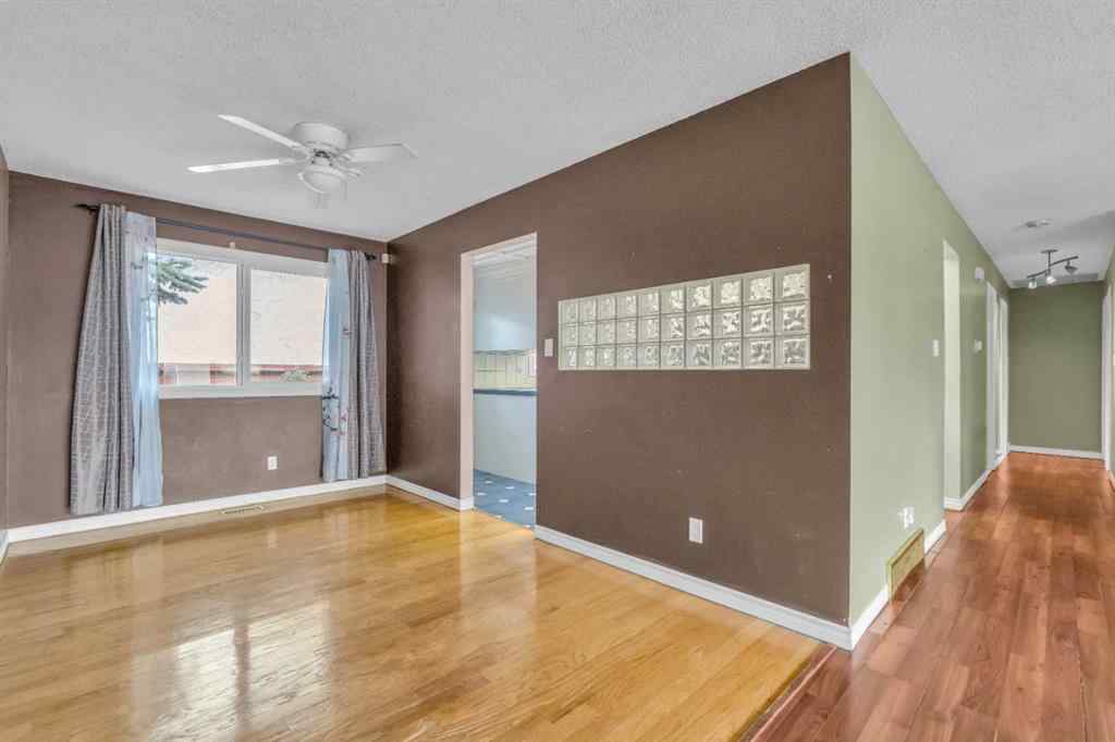 MLS® A2250254 - 403 Queen Alexandra Way SE in Queensland Calgary, Residential