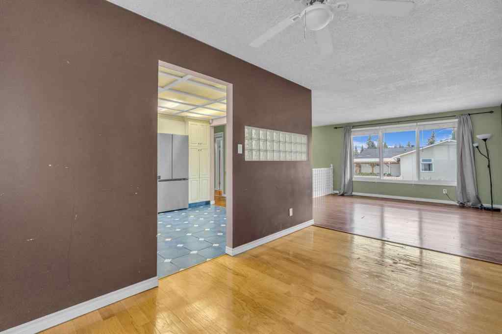 MLS® A2250254 - 403 Queen Alexandra Way SE in Queensland Calgary, Residential