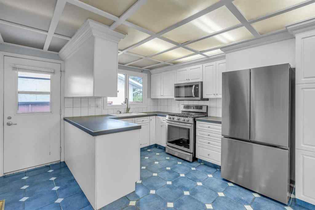 MLS® A2250254 - 403 Queen Alexandra Way SE in Queensland Calgary, Residential