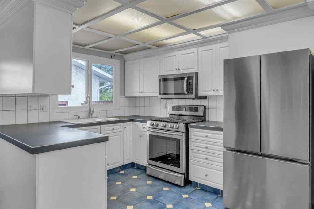 MLS® A2250254 - 403 Queen Alexandra Way SE in Queensland Calgary, Residential