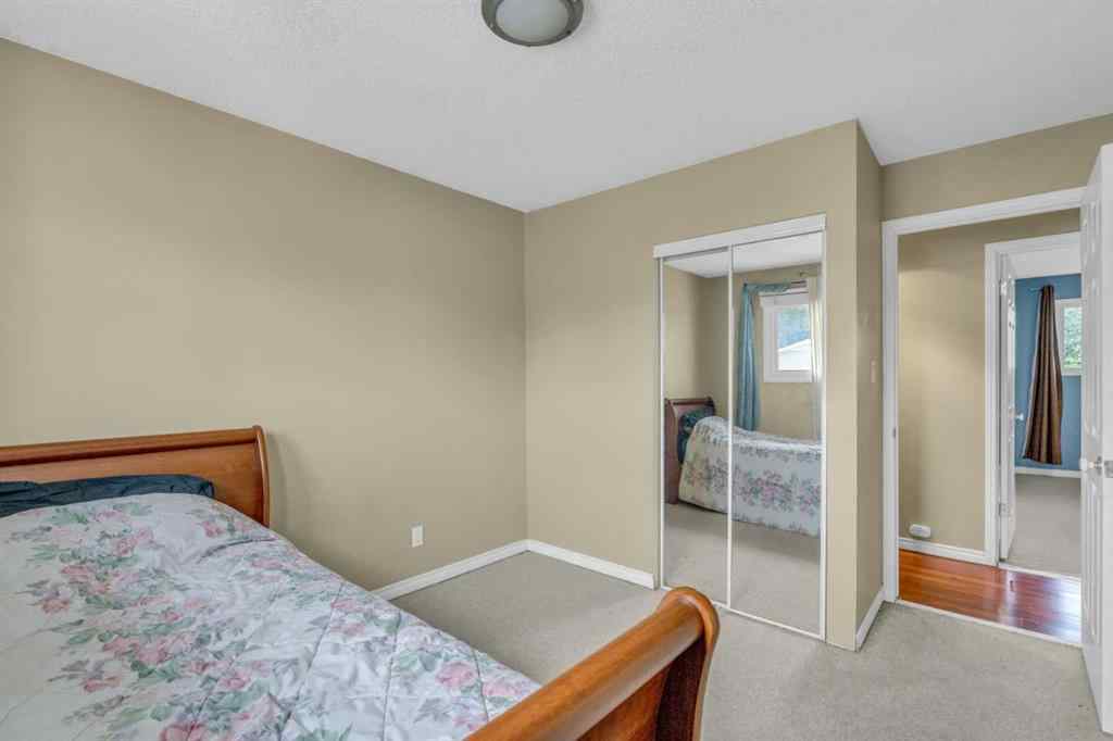 MLS® A2250254 - 403 Queen Alexandra Way SE in Queensland Calgary, Residential