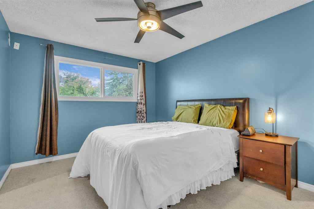 MLS® A2250254 - 403 Queen Alexandra Way SE in Queensland Calgary, Residential