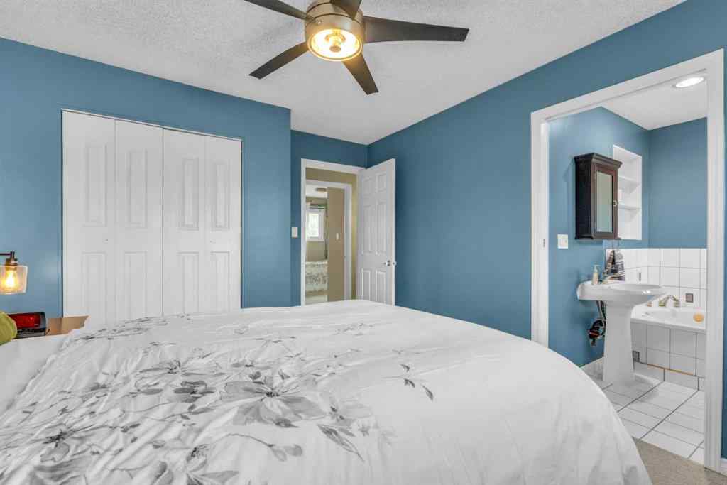MLS® A2250254 - 403 Queen Alexandra Way SE in Queensland Calgary, Residential