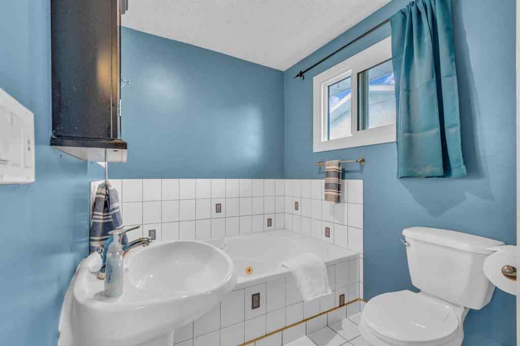 MLS® A2250254 - 403 Queen Alexandra Way SE in Queensland Calgary, Residential