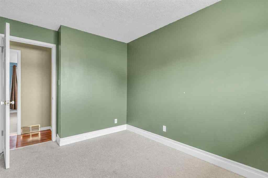 MLS® A2250254 - 403 Queen Alexandra Way SE in Queensland Calgary, Residential