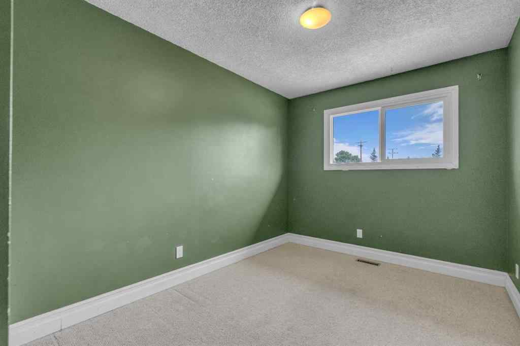MLS® A2250254 - 403 Queen Alexandra Way SE in Queensland Calgary, Residential