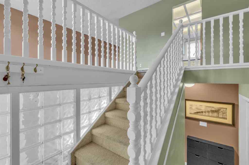 MLS® A2250254 - 403 Queen Alexandra Way SE in Queensland Calgary, Residential