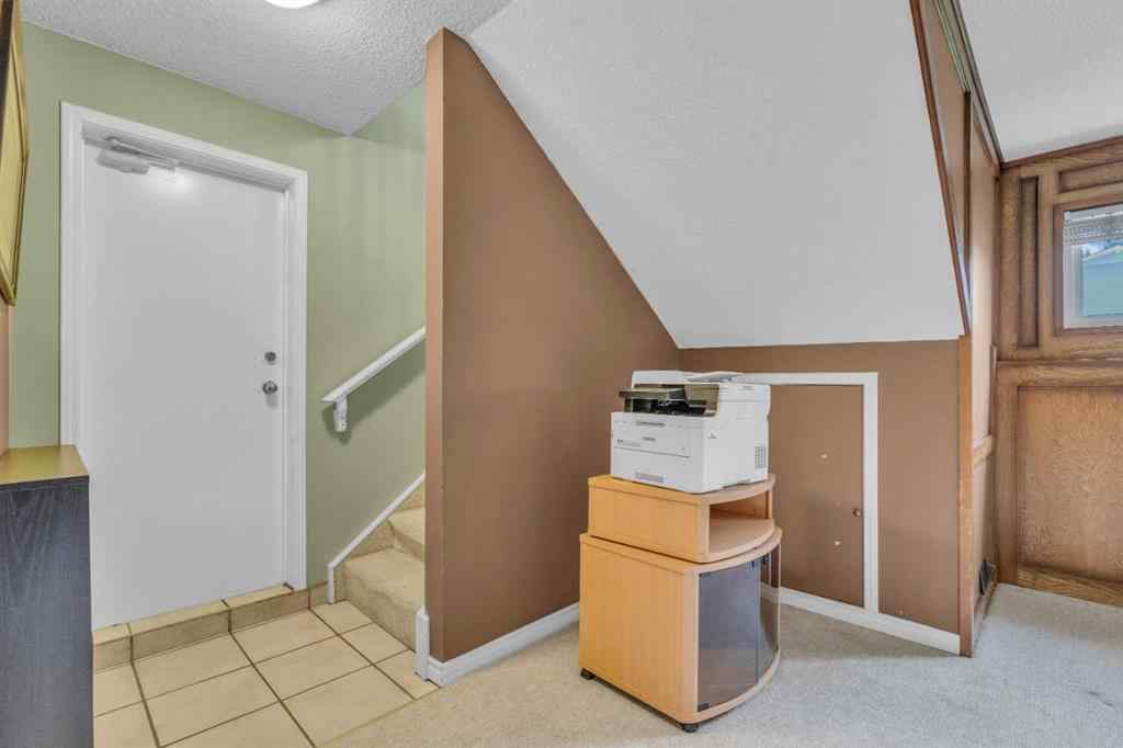 MLS® A2250254 - 403 Queen Alexandra Way SE in Queensland Calgary, Residential