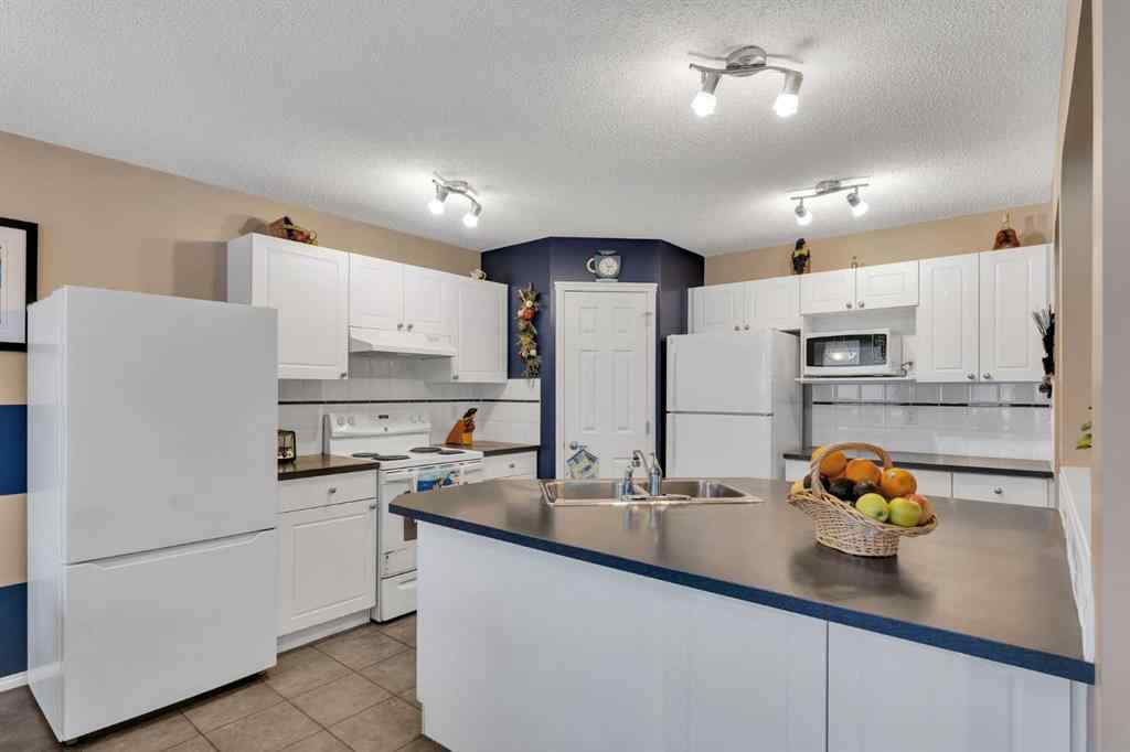 MLS® A2250347 - 15 Saddletree Drive NE in Saddle Ridge Calgary, Residential