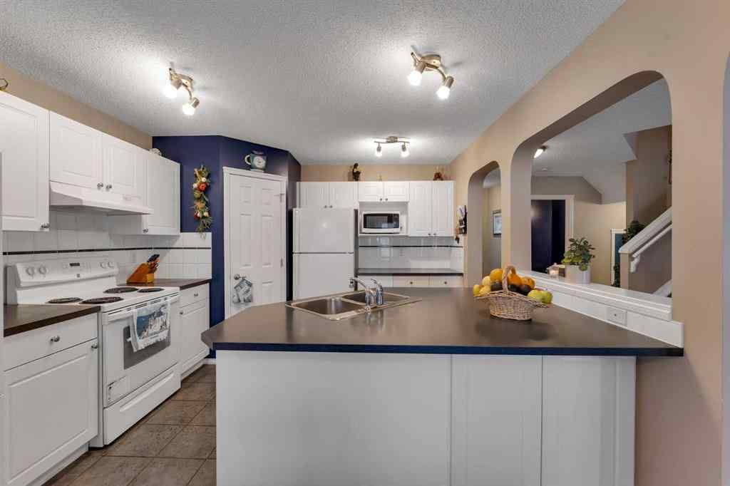 MLS® A2250347 - 15 Saddletree Drive NE in Saddle Ridge Calgary, Residential