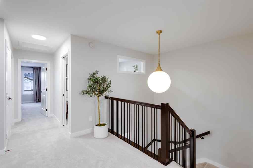 MLS® A2250438 - 104 Sundown Crescent  in Sunset Ridge Cochrane, Residential