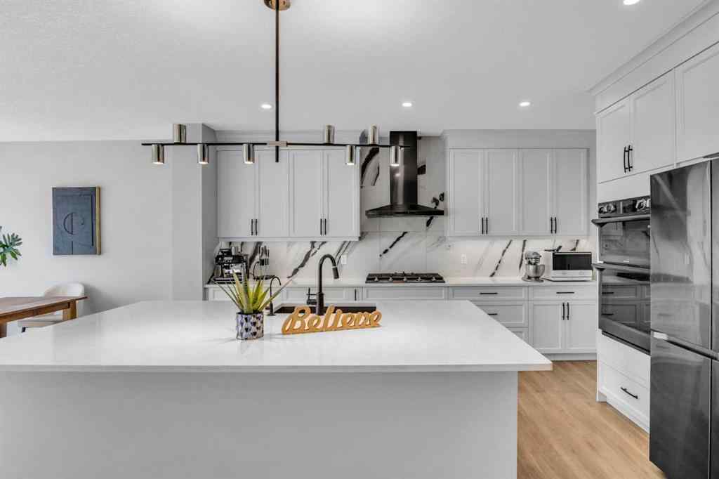 MLS® A2250532 - 21 Ambleside Crescent NW in Moraine Calgary, Residential