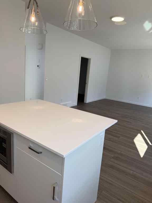 MLS® A2250709 - Unit #104 1453 Na'a Drive SW in Medicine Hill Calgary, Residential