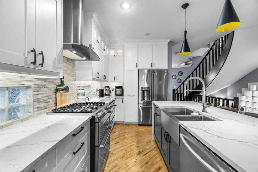 MLS® A2250847 - 2409 7 Avenue NW in West Hillhurst Calgary, Residential