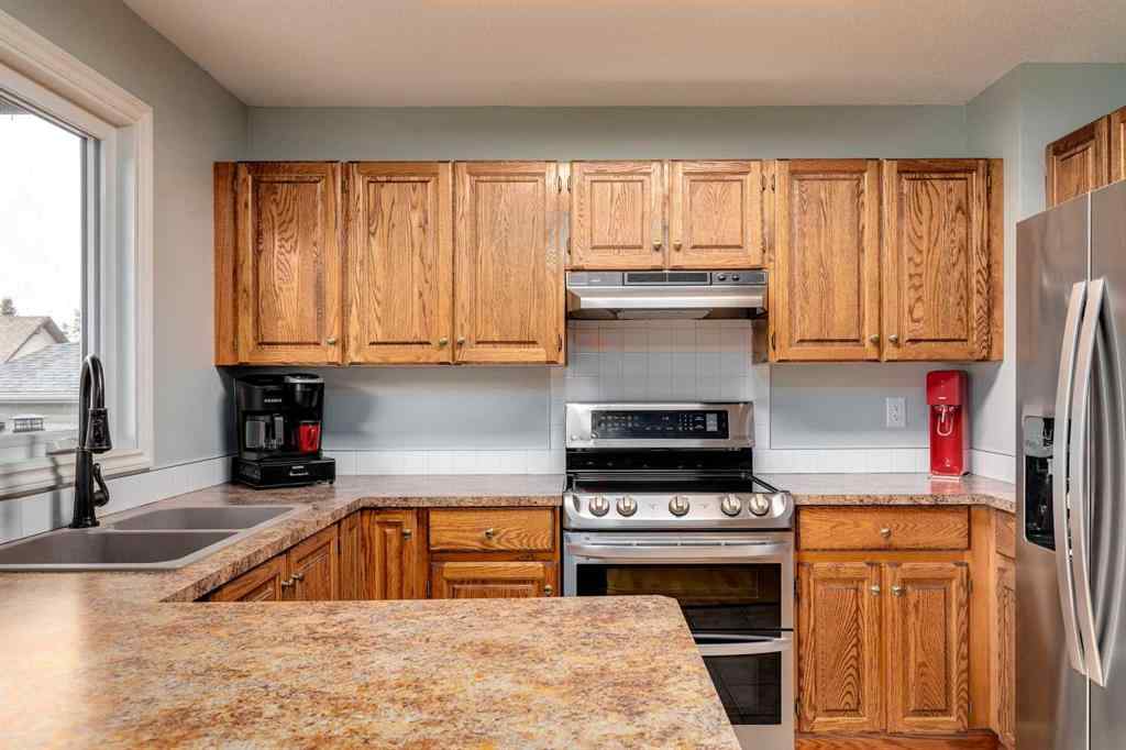 MLS® A2250869 - 103 Macewan Park Road NW in MacEwan Glen Calgary, Residential