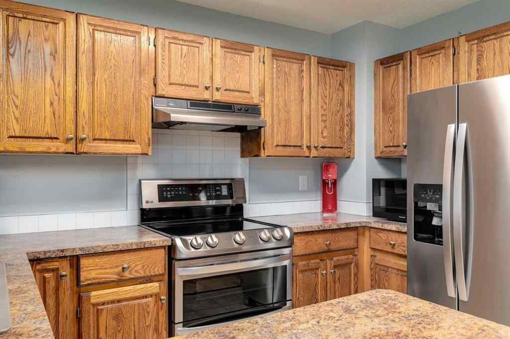 MLS® A2250869 - 103 Macewan Park Road NW in MacEwan Glen Calgary, Residential
