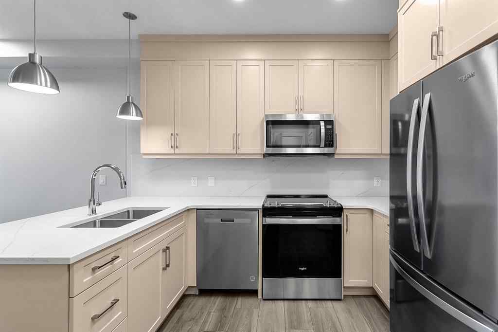 MLS® A2250943 - Unit #416 8355 19 Avenue SW in Springbank Hill Calgary, Residential