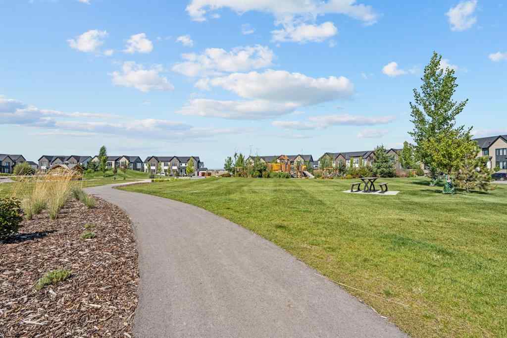 MLS® A2251042 - 1002 Harmony Parade  in Harmony Rural Rocky View County, Residential
