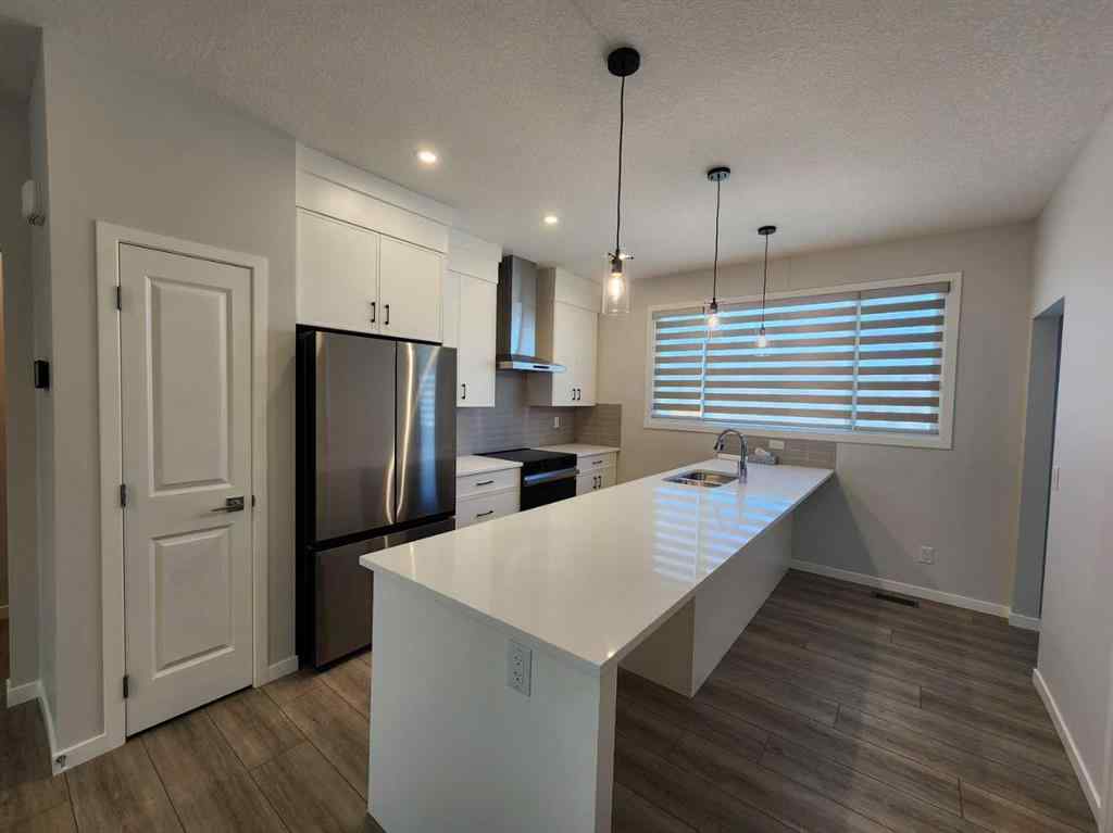 MLS® A2251173 - 73 Herron Common NE in Livingston Calgary, Residential