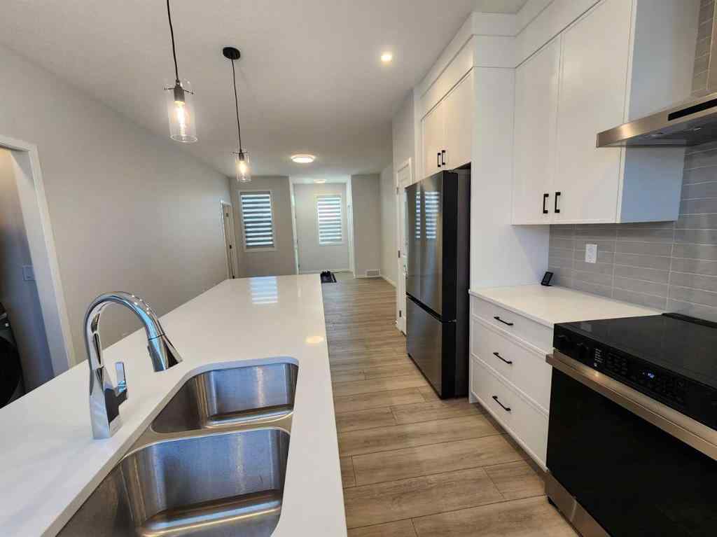 MLS® A2251173 - 73 Herron Common NE in Livingston Calgary, Residential