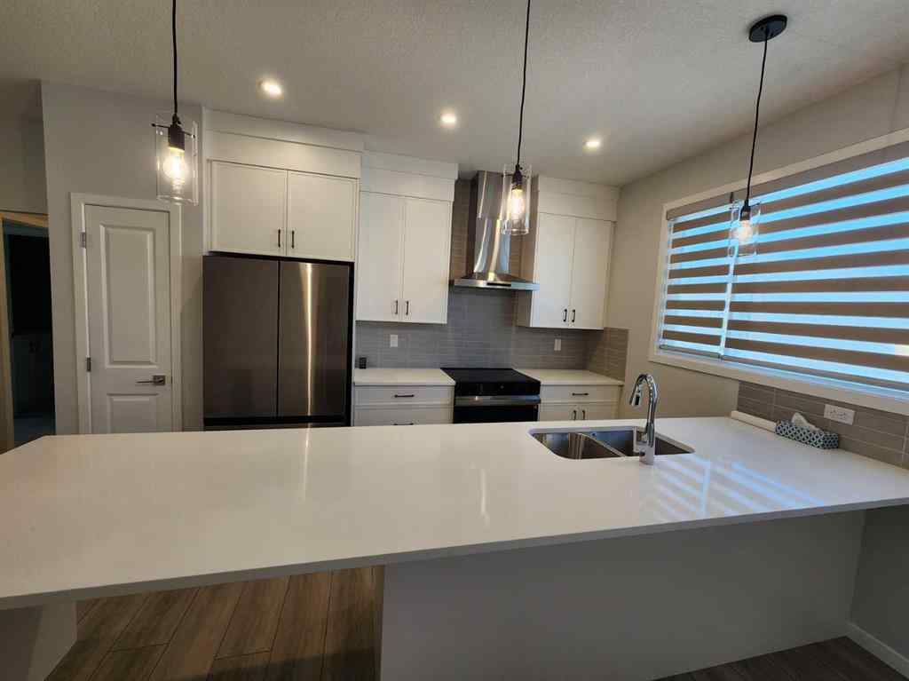 MLS® A2251173 - 73 Herron Common NE in Livingston Calgary, Residential