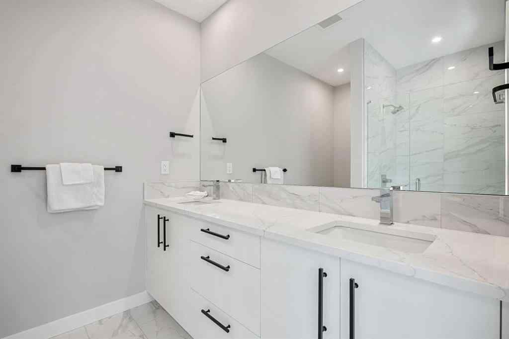 MLS® A2251334 - 8149 8 Avenue SW in West Springs Calgary, Residential