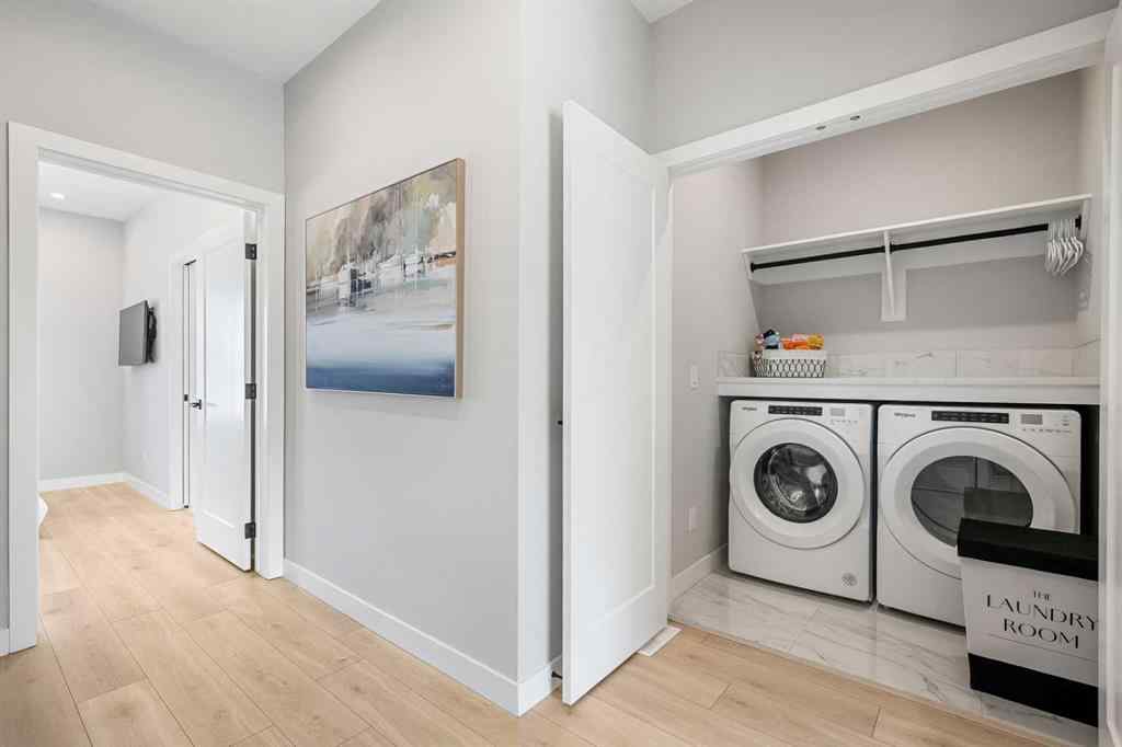 MLS® A2251334 - 8149 8 Avenue SW in West Springs Calgary, Residential