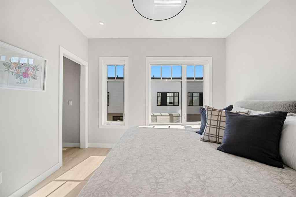 MLS® A2251334 - 8149 8 Avenue SW in West Springs Calgary, Residential