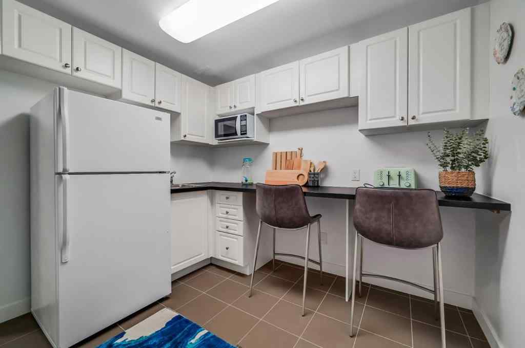 MLS® A2251576 - 836B 68 Avenue SW in Kingsland Calgary, Residential