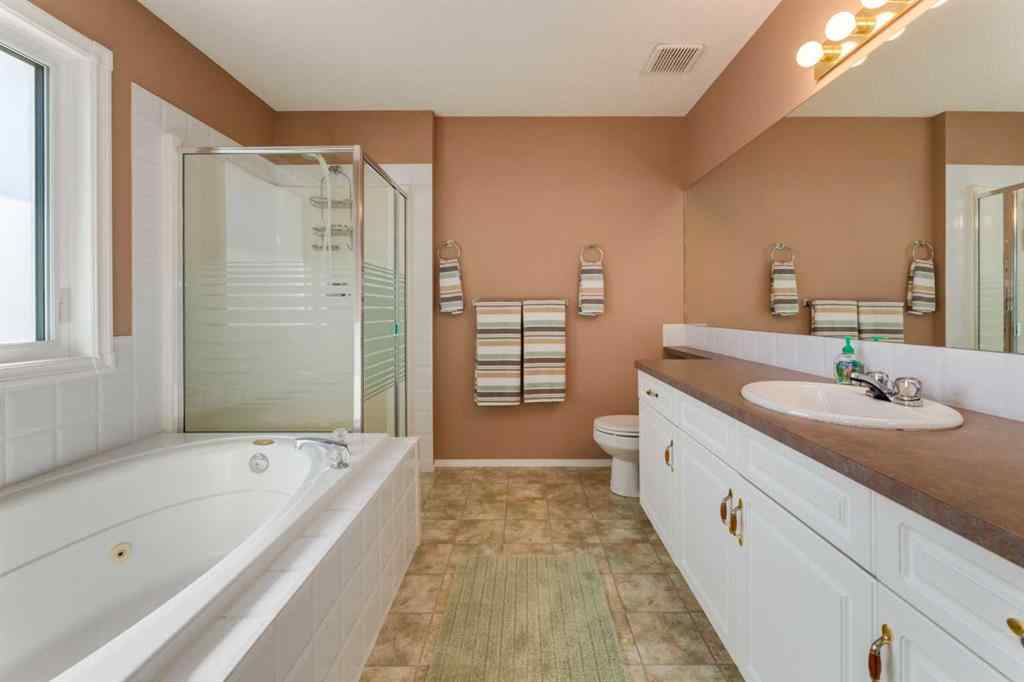 MLS® A2251606 - 165 Spring Crescent SW in Springbank Hill Calgary, Residential