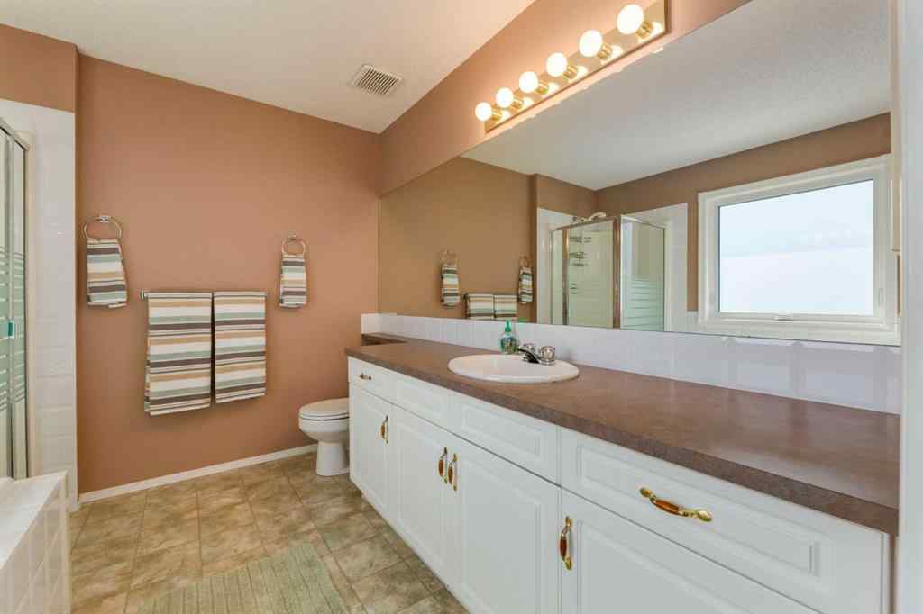 MLS® A2251606 - 165 Spring Crescent SW in Springbank Hill Calgary, Residential