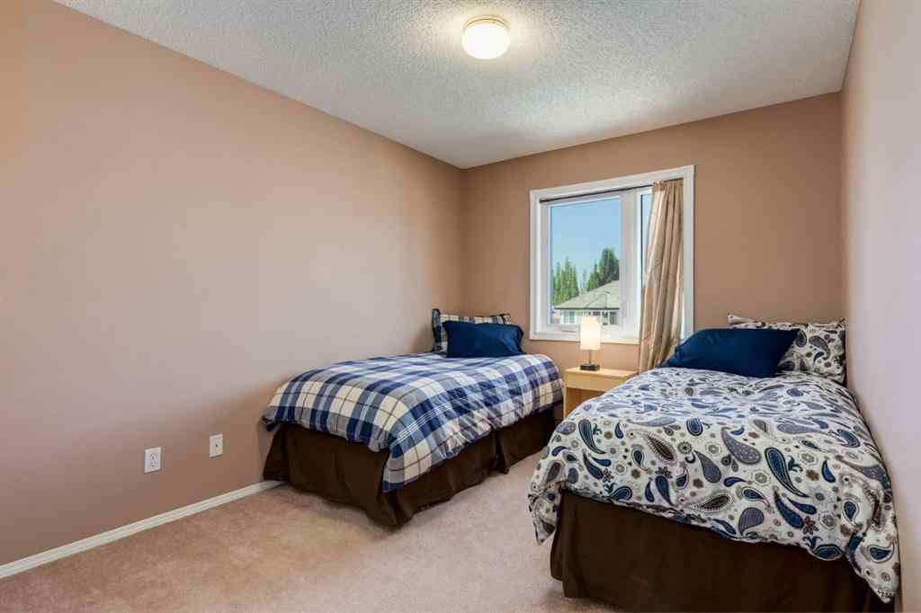 MLS® A2251606 - 165 Spring Crescent SW in Springbank Hill Calgary, Residential