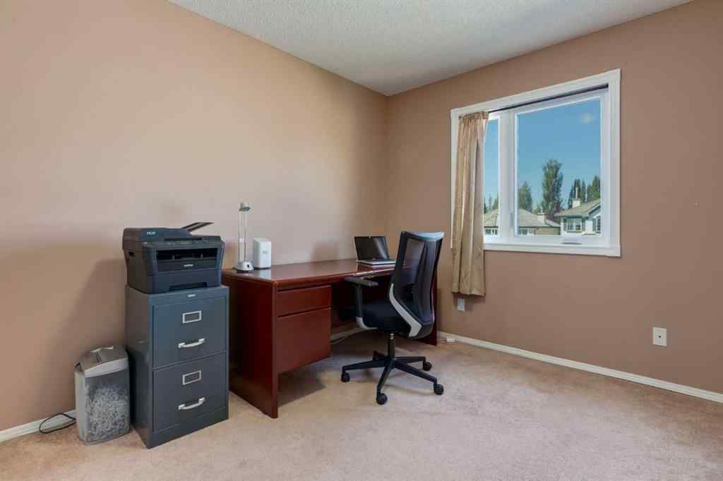 MLS® A2251606 - 165 Spring Crescent SW in Springbank Hill Calgary, Residential