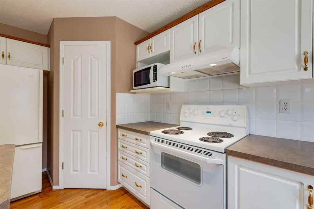 MLS® A2251606 - 165 Spring Crescent SW in Springbank Hill Calgary, Residential