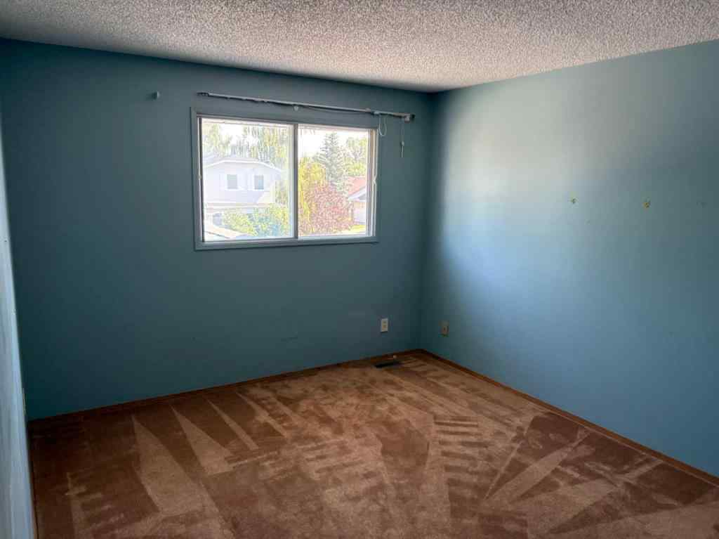 MLS® A2251615 - 256 Woodstock Place SW in Woodlands Calgary, Residential