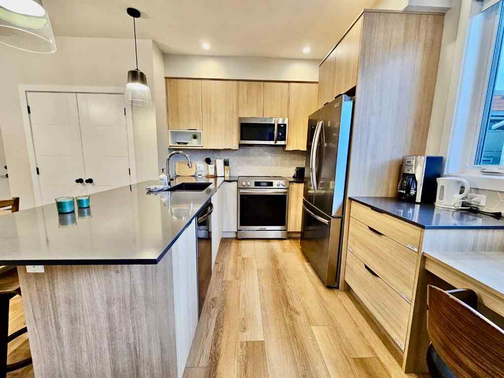 MLS® A2251804 - Unit #202I 209 Stewart Creek Rise  in Three Sisters Canmore, Residential
