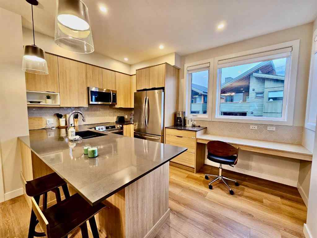MLS® A2251804 - Unit #202I 209 Stewart Creek Rise  in Three Sisters Canmore, Residential