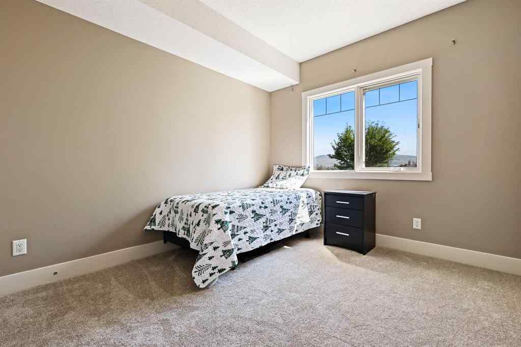 MLS® A2252019 - Unit #107 77 George Fox Trail  in Bow Meadows Cochrane, Residential