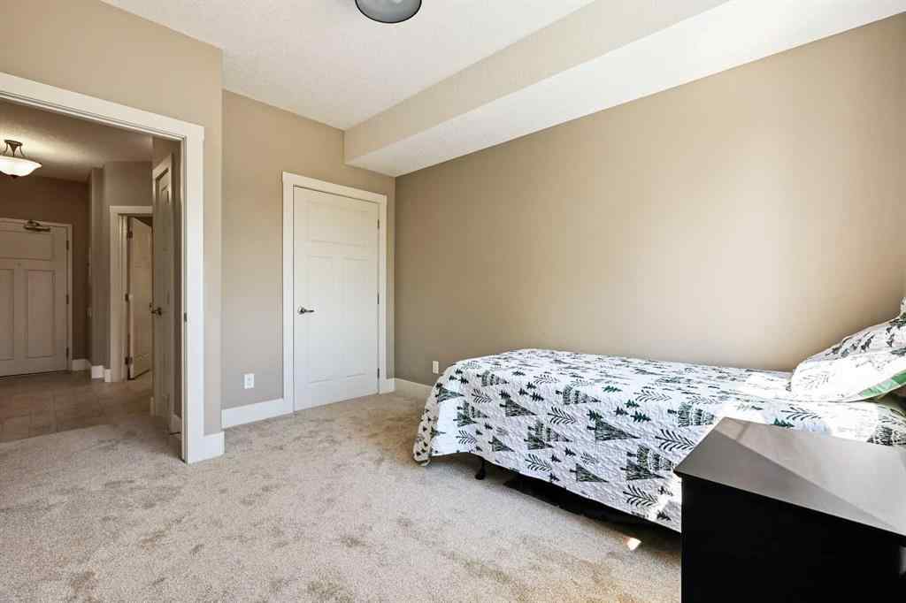MLS® A2252019 - Unit #107 77 George Fox Trail  in Bow Meadows Cochrane, Residential
