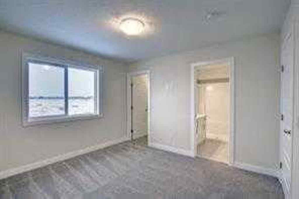 MLS® A2252055 - 63 Lambeau Lane SE in Lanark Airdrie, Residential
