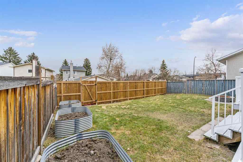 MLS® A2252125 - 395 Millrise Drive SW in Millrise Calgary, Residential