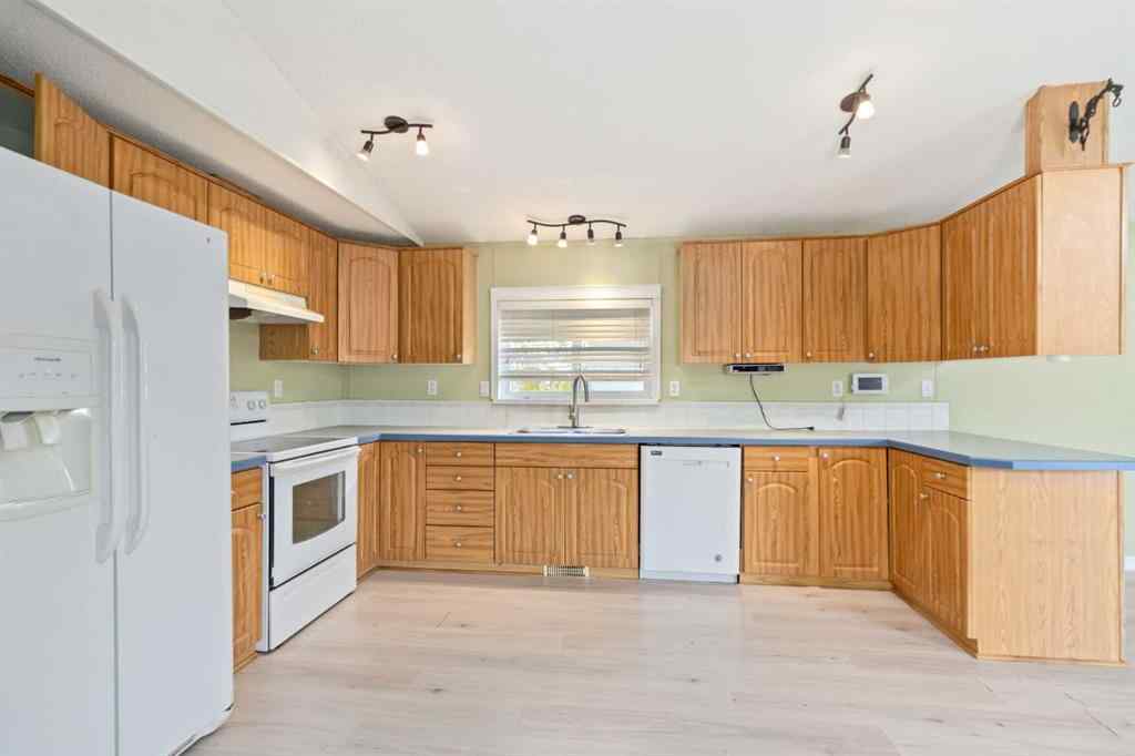 MLS® A2252399 - 215 Grant Way  in Gregoire Park Fort McMurray, Residential