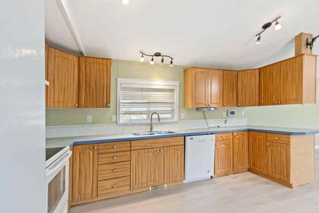 MLS® A2252399 - 215 Grant Way  in Gregoire Park Fort McMurray, Residential