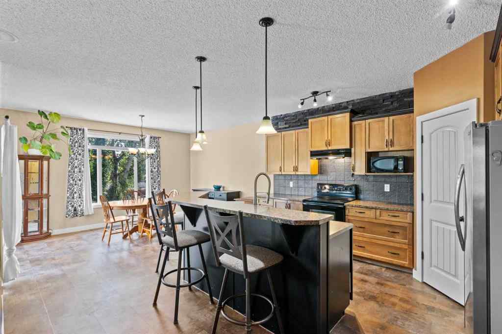 MLS® A2252549 - 212 Crystal Green Place  in Crystal Green Okotoks, Residential