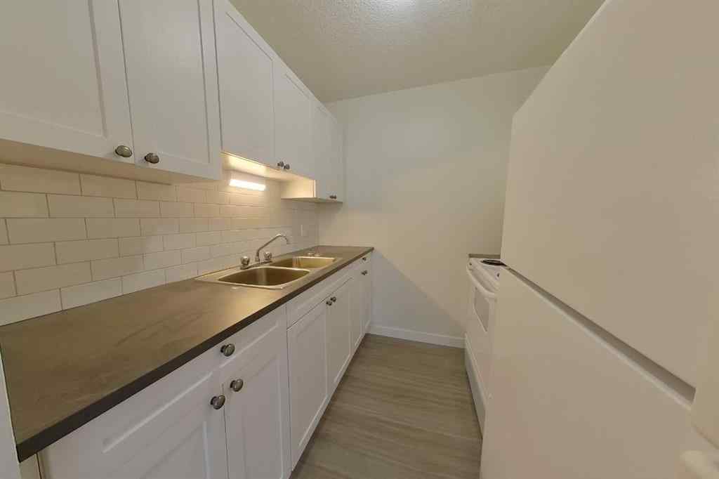 MLS® A2252740 - Unit #104 13221 Macdonald Drive  in Downtown Fort McMurray, Residential