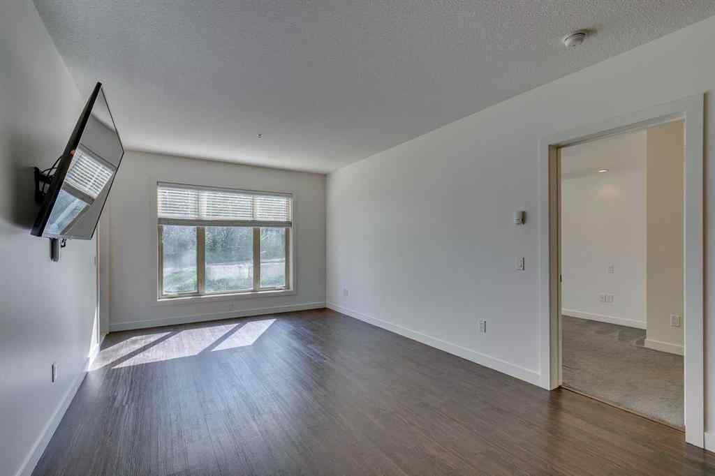 MLS® A2252950 - Unit #107 25 Aspenmont Heights SW in Aspen Woods Calgary, Residential