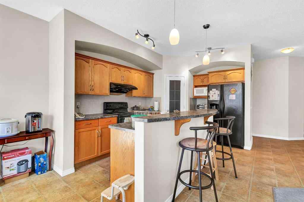 MLS® A2253000 - 156 Saddlecrest Park NE in Saddle Ridge Calgary, Residential
